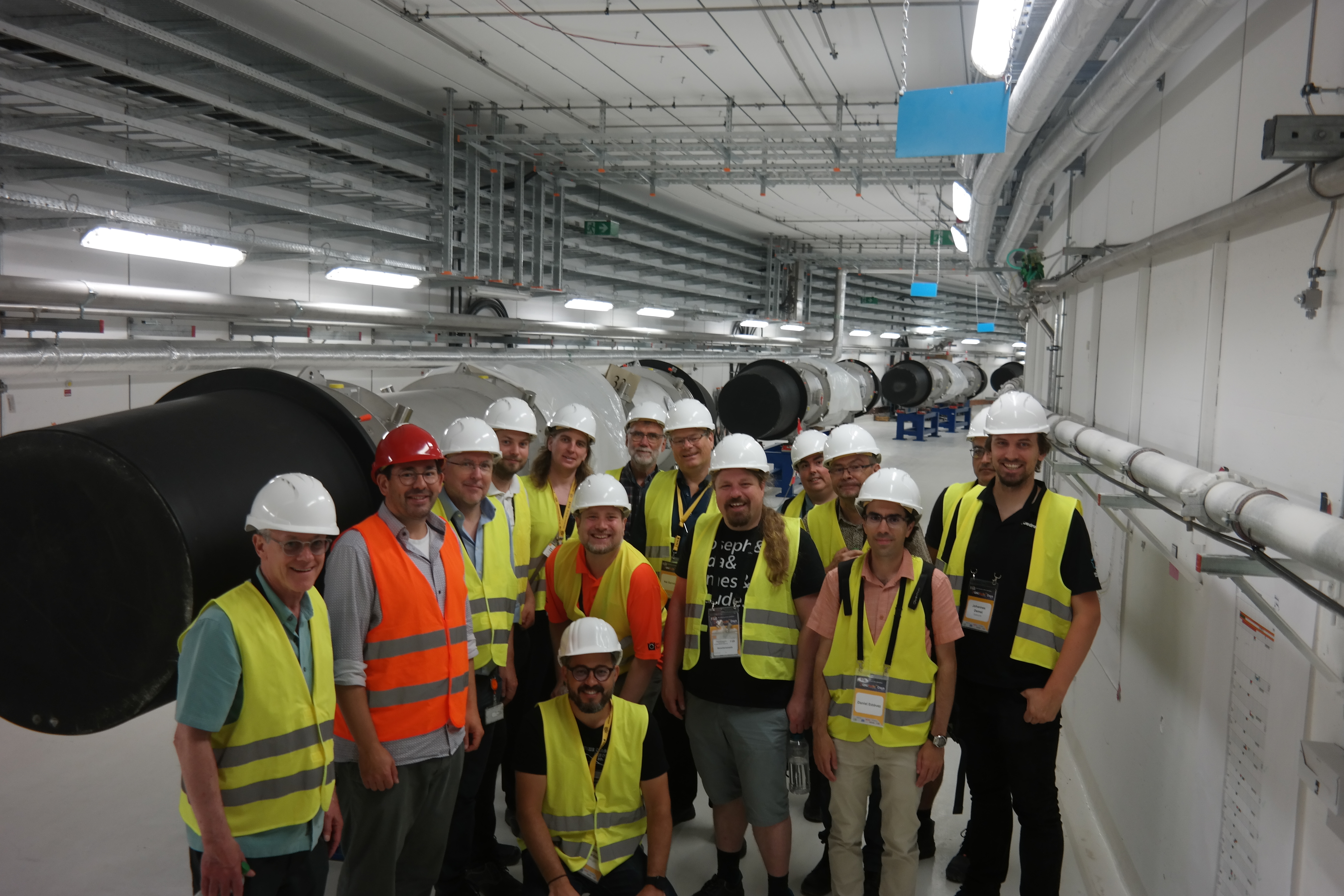 Group photo of one of the FAIR construction site tours inside the SIS100 tunnel where some magnets have already been set up